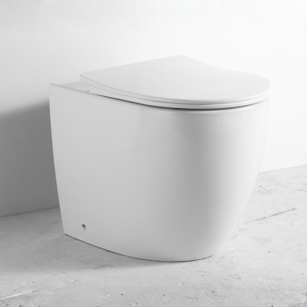 WC filo muro FT53A a pavimento in ceramica 52.5x37x41H cm. bianco WC filo muro FT53A a pavimento in ceramica 52.5x37x41H cm. bianco